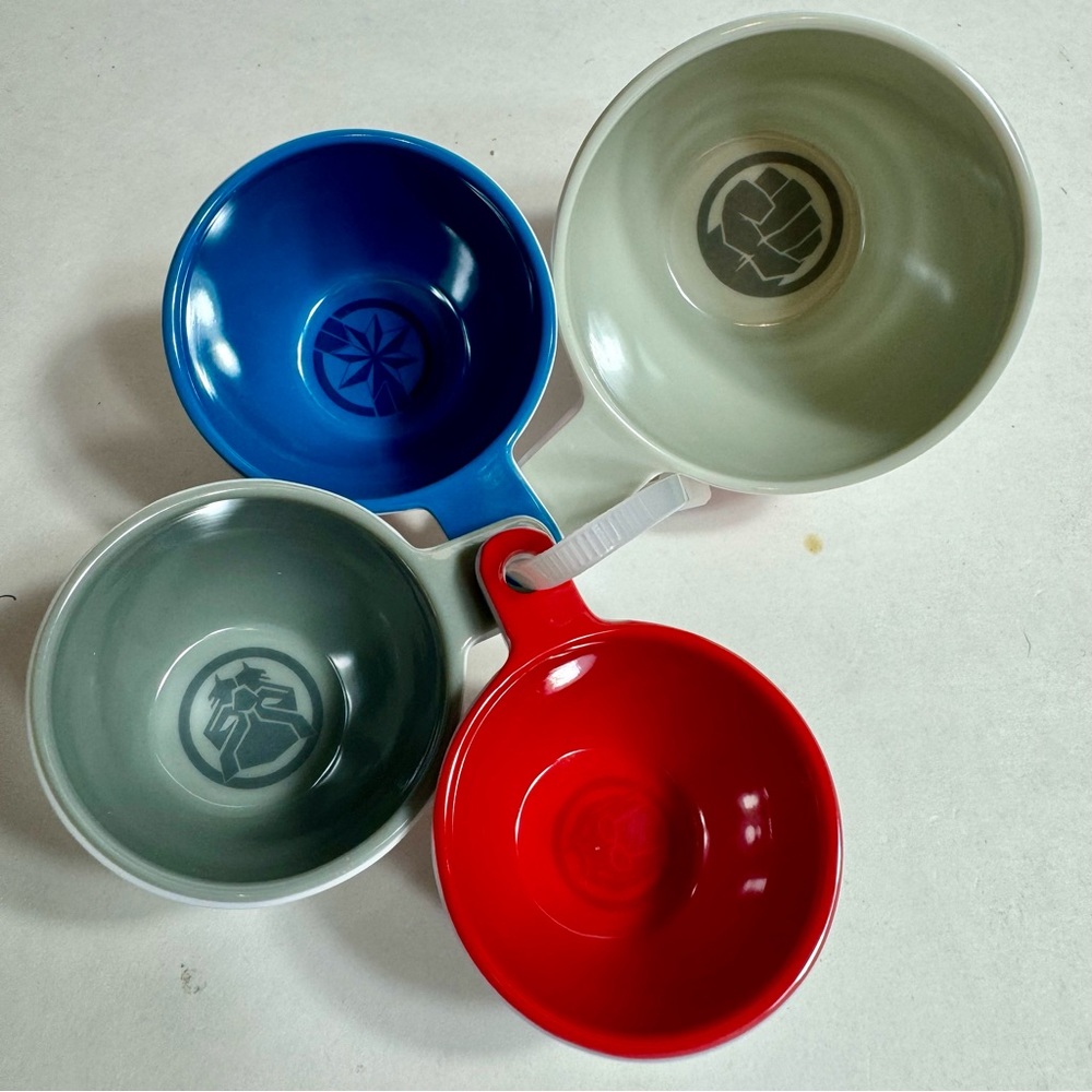 NWT. Disney Marvel Kitchen Collection 4 Measuring Cups 2/3,1/3,1/4,1/8 Cup Sizes